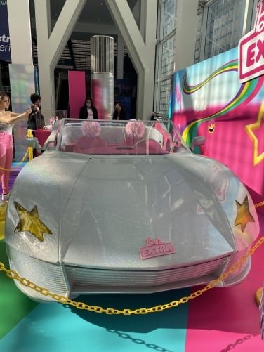 The front view of the Barbie Extra car shows yellow star headlights.