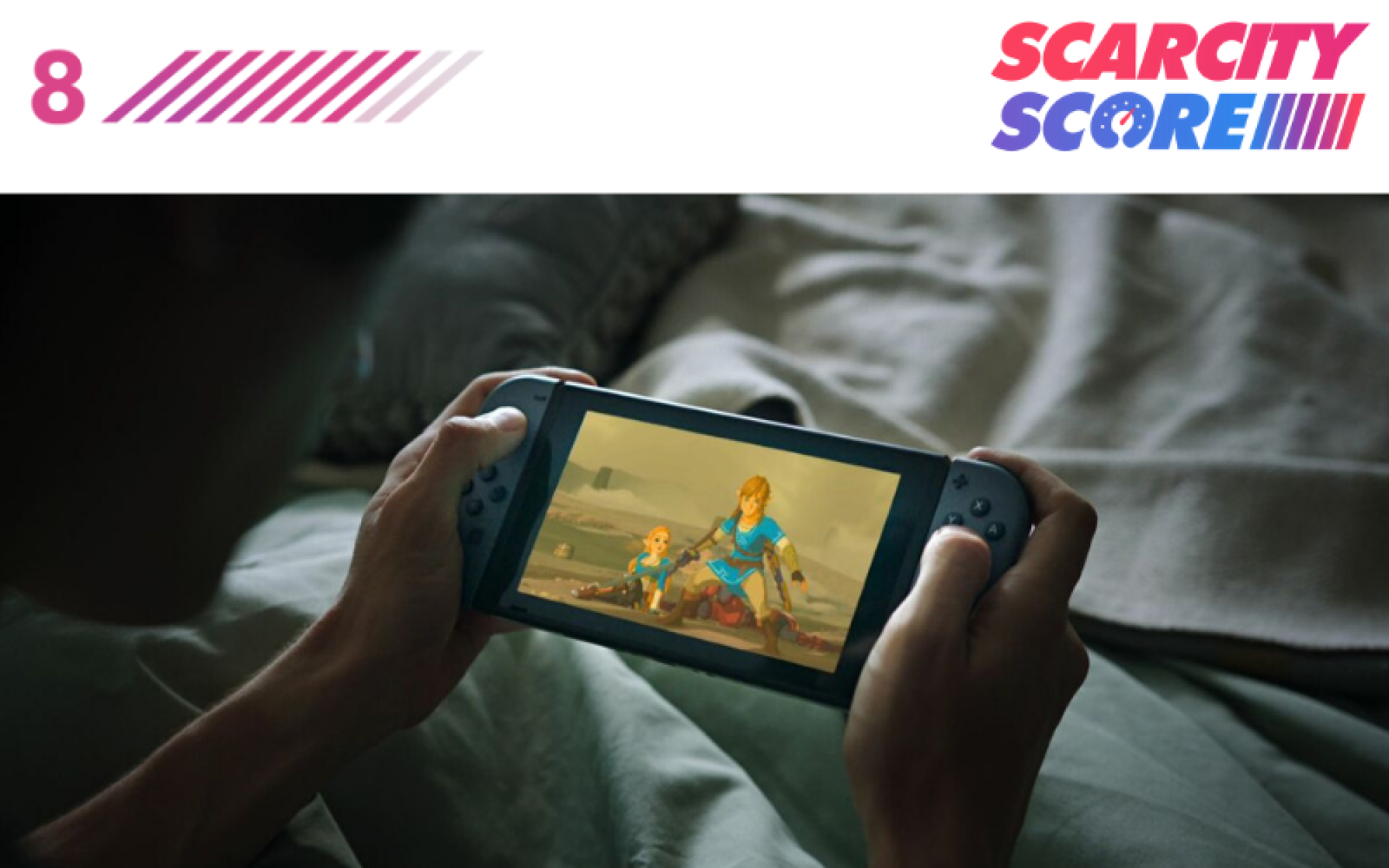 someone playing a Nintendo Switch while in bed